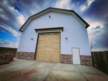 Brick facade work on the outside of a large barn/shop